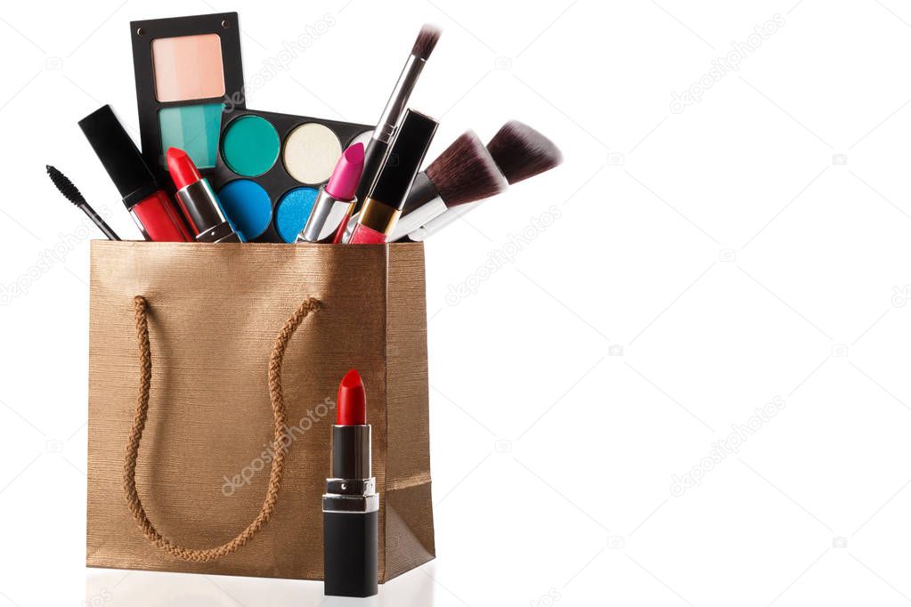Different makeup objects in shopping bag