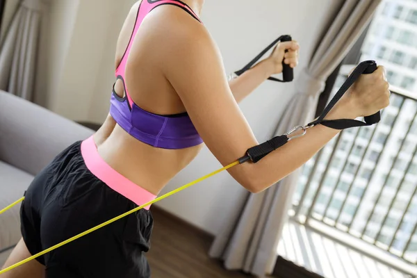 Home workout with a rubber resistance bands — Stock Photo, Image