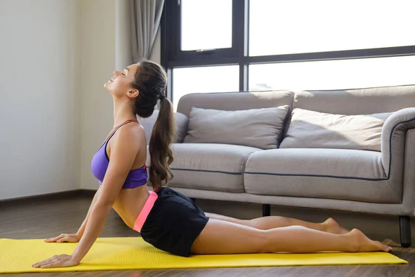 Woman during stretching workout at home — 스톡 사진