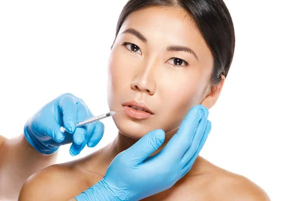 Asian woman during lips augmentation procedure. — Stock Photo, Image
