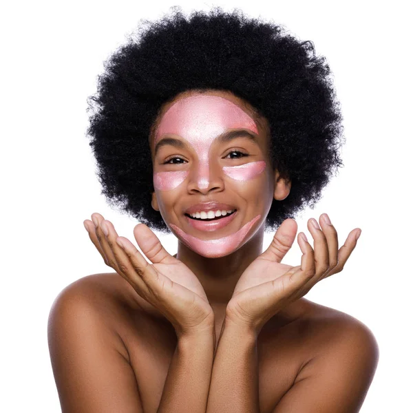 Young African woman with a purifying mask on her face — Stock Photo, Image