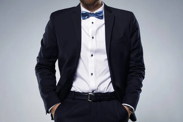 Man in navy blue suit with bow tie — Stock Photo, Image