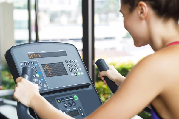 Fitness workout on stationary bike in the gym — Stock Photo, Image