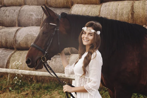 Cute young woman and her beautiful horse — Stock Photo, Image