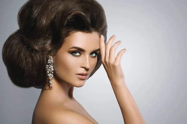 Gorgeous woman with a beautiful hairstyle and make-up