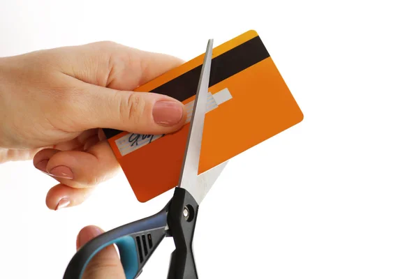 Woman cutting her credit card with a scissors — Stock Photo, Image