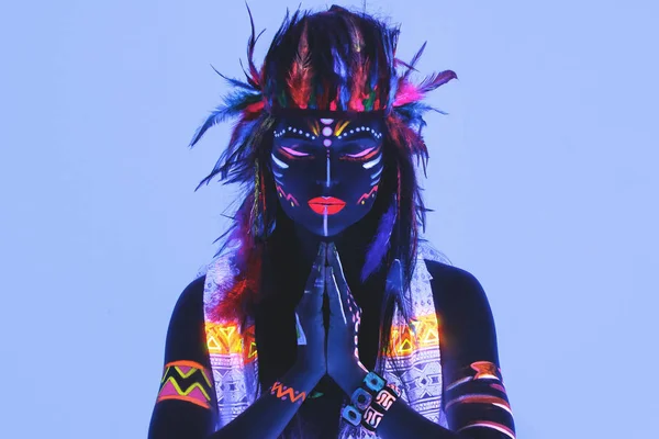 Woman with a neon makeup in ultraviolet light — Stock Photo, Image