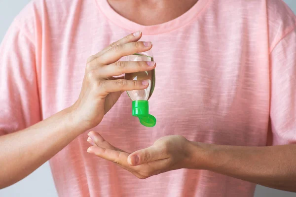 Woman with a small bottle of hand sanitizer — Stock Photo, Image