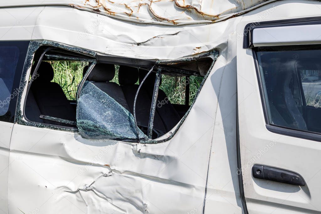 Smashed minivan after serious car accident