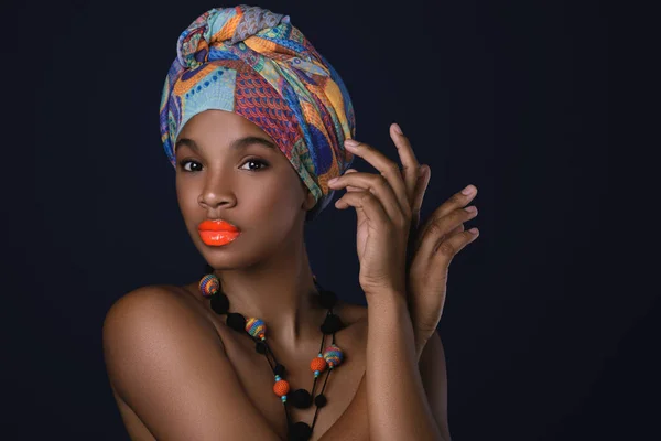 African woman with a colorful shawl on her head — Stock Photo, Image