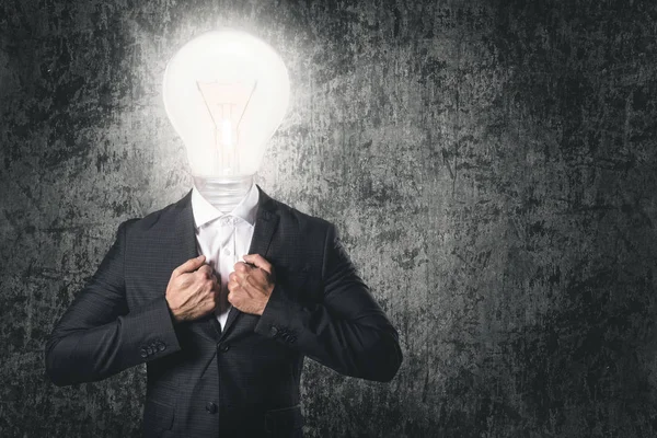 Got an idea! Businessman with light bulb instead head.