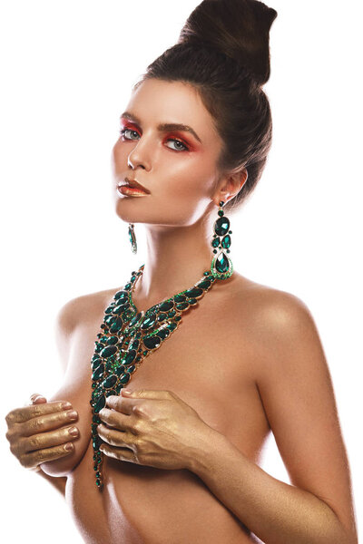 Sexy woman wearing big beautiful necklace with a lot of gems