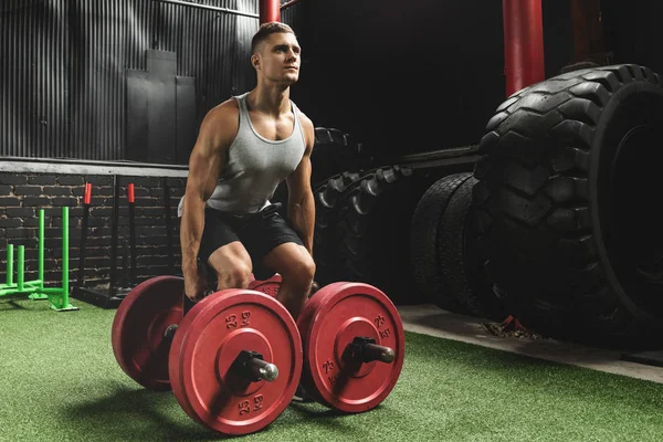 Sportsman doing farmer's walk exercise during his cross training — Stock Photo, Image