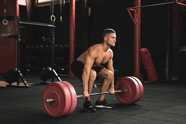 Deadlift exercise. Man during his workout in the gym — Stock Photo, Image