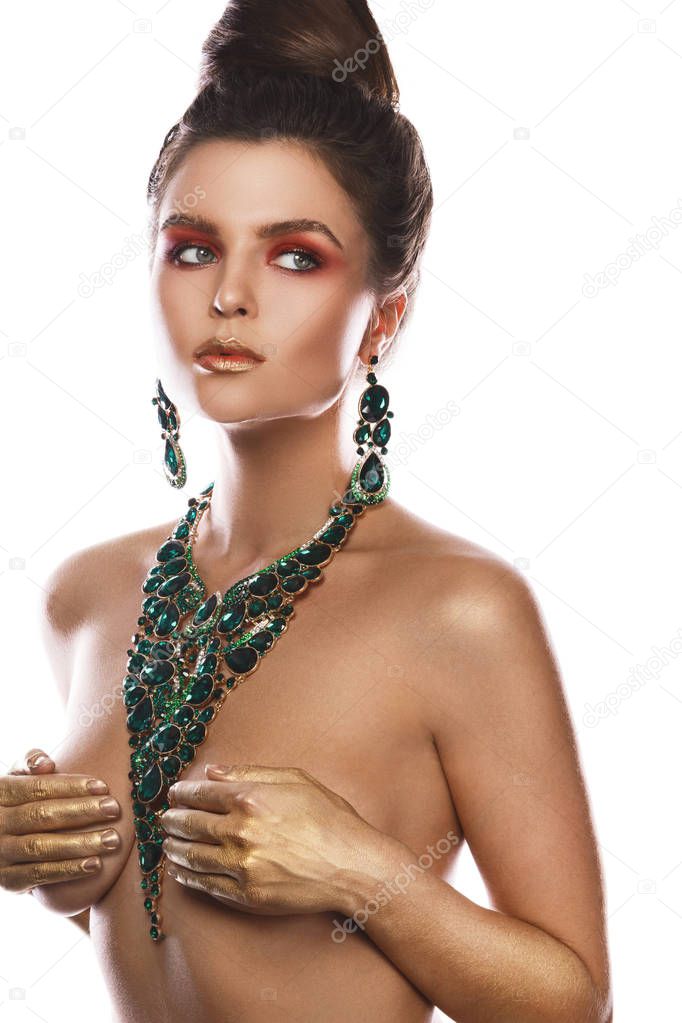 Sexy woman wearing big beautiful necklace with a lot of gems