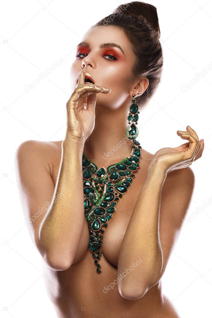 Sexy woman wearing big beautiful necklace with a lot of gems