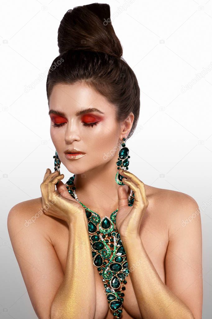 Sexy woman wearing big beautiful necklace with a lot of gems