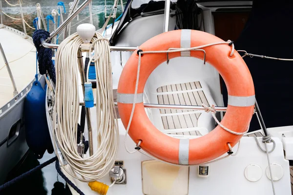 Lifebuoy orange in power boat. Concept rescue on water in summer.