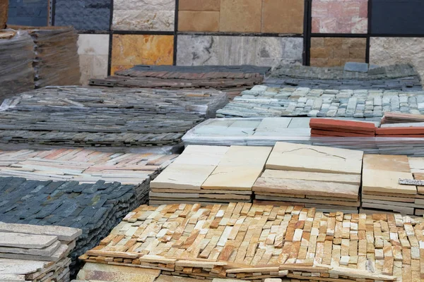 Construction Materials. Natural stone for decoration in construction is sold on market. Building rock materials for decoration and construction.