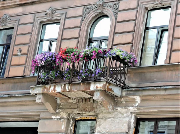 Facade of old house with balcony in Saint-Petersburg
