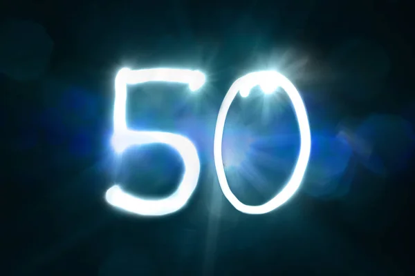 Fifty Numbers written with a flashlight during long exposure — Stock Photo, Image