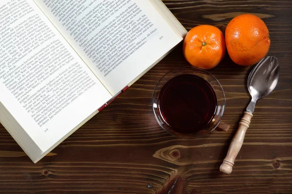 tea mulled wine reading book winter christmas oranges