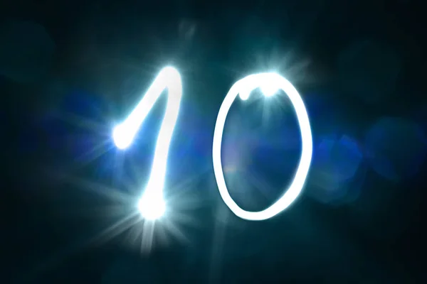 Dez Números escritos com uma lanterna durante a exposição longa — Fotografia de Stock