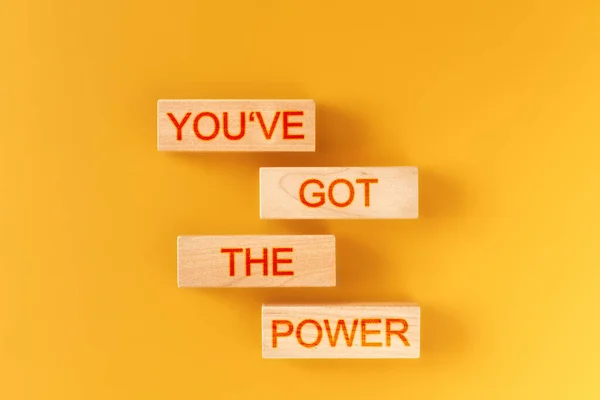 you've got the power. wooden blocks saying you've got the power on an orange background