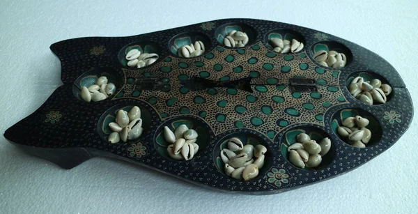 Batik Mancala from Java, Indonesia. Mancala is a family of board games played around the world. Also known as Dakon or Congklak in South East Asia.