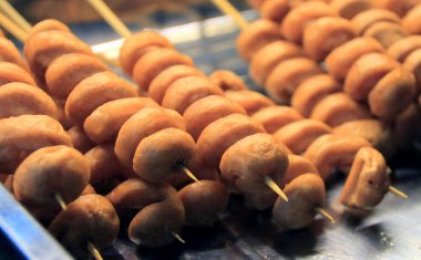 Yogyakarta, Indonesia - August 19, 2017: Sausage satay at Angkringan Mbak Mlenuk.