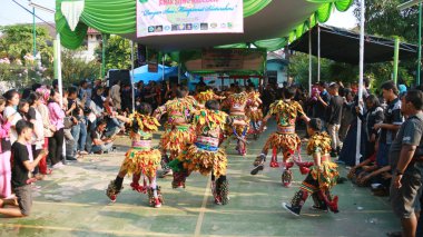 Jakarta, Indonesia - May 13, 2018: Member of Sinar Siswo Magelang dancing Gedruk Rampak Buto, traditonal performing art from Central Java, in Pondok Kopi District, East Jakarta. 