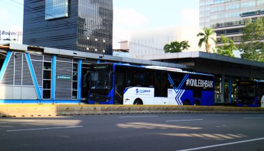Jakarta, Indonesia - March 4, 2019: Sarinah Transjakarta bus shelter on Jalan MH Thamrin.