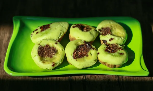 Pinch Cake or kue cubit on black background. Traditional Indonesian cakes normally sold by street vendors.