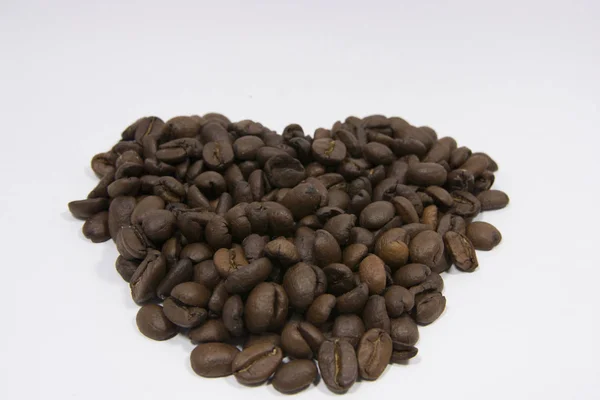 Roasted Mocha Coffee Beans close-up. Java coffee beans against white background.