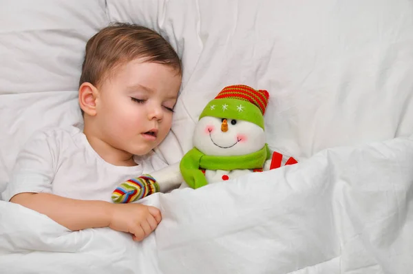 Cute Toddler Boy Sleeping White Linen His Favorite Toy Snowman — Stock Photo, Image