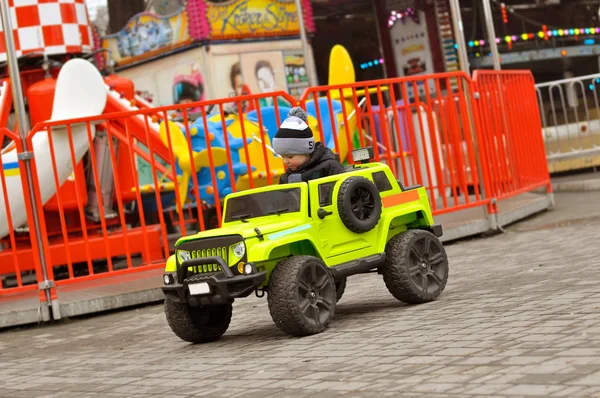 Cute Year Old Boy Hat Jacket Riding Green Electric Car — Stock Photo, Image