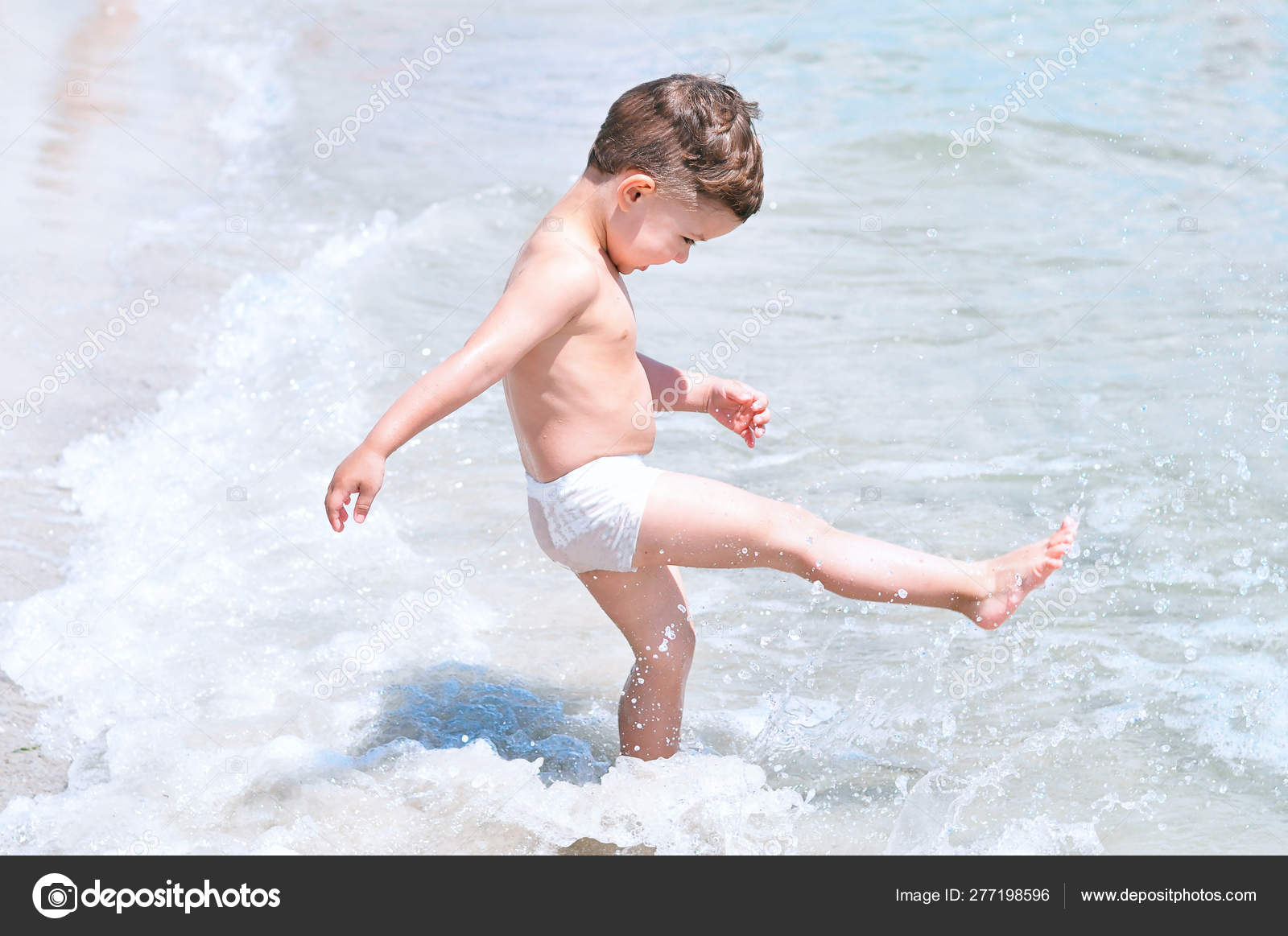 boys swiming at the black sea Cute Little Boy Beach White Swimming Trunks Having Fun Kicking — Stock  Photo © Volkonskaya #277198596