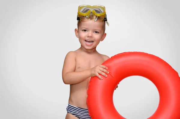 Cute Little Boy Laughs Striped Swimming Trunks Red Inflatable Ring — Stock Photo, Image