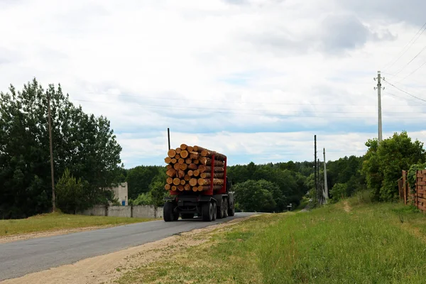 timber truck transports timber from logging