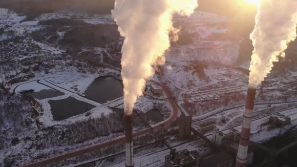 Aerial view of smoke rising from the chimney of a coal boiler. Top view, rotate the camera. — Stock Video