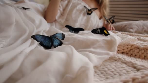 Portrait of an attractive young woman with butterflies. — Stock Video