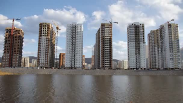 Time lapse of construction of a new district by the river. — Stock Video