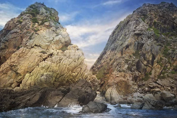 Quy Nhon landscape of two side by side mountains and waves crashing