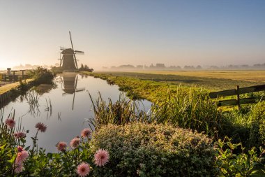 Sunrise behind the Windmills near Leidschendam, South Holland, Netherlands   clipart