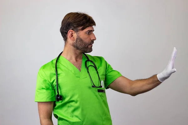 Portrait of male veterinary doctor in green uniform with brown h — Stock Photo, Image