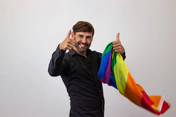Portrait of handsome young man with gay pride movement LGBT Rain