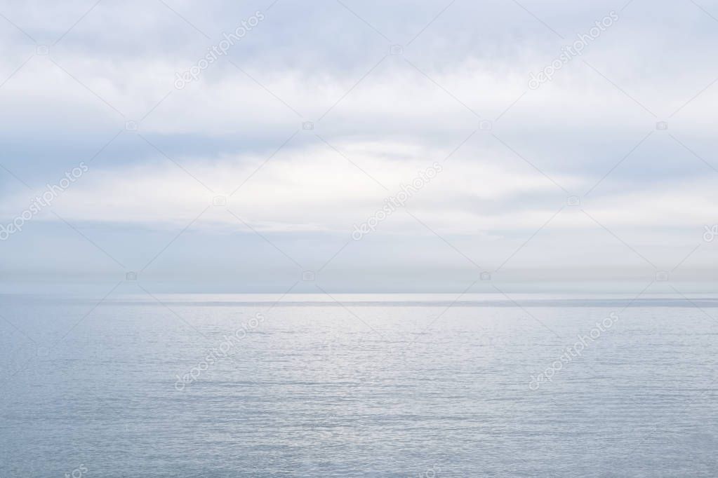 Gentle sunset on the sea coast in calm pastel colors