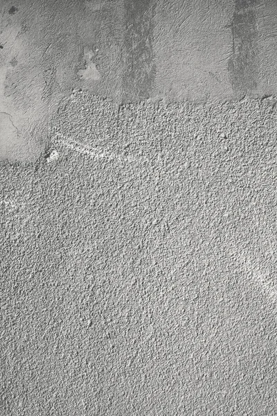 Rough top coating of the concrete wall, textured background.