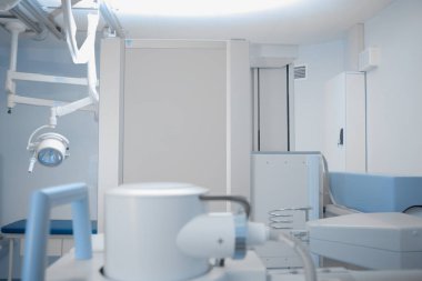 Hospital room with X-ray equipment. clipart