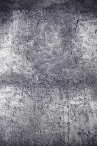 Grunge concrete wall with cracks, textured background.